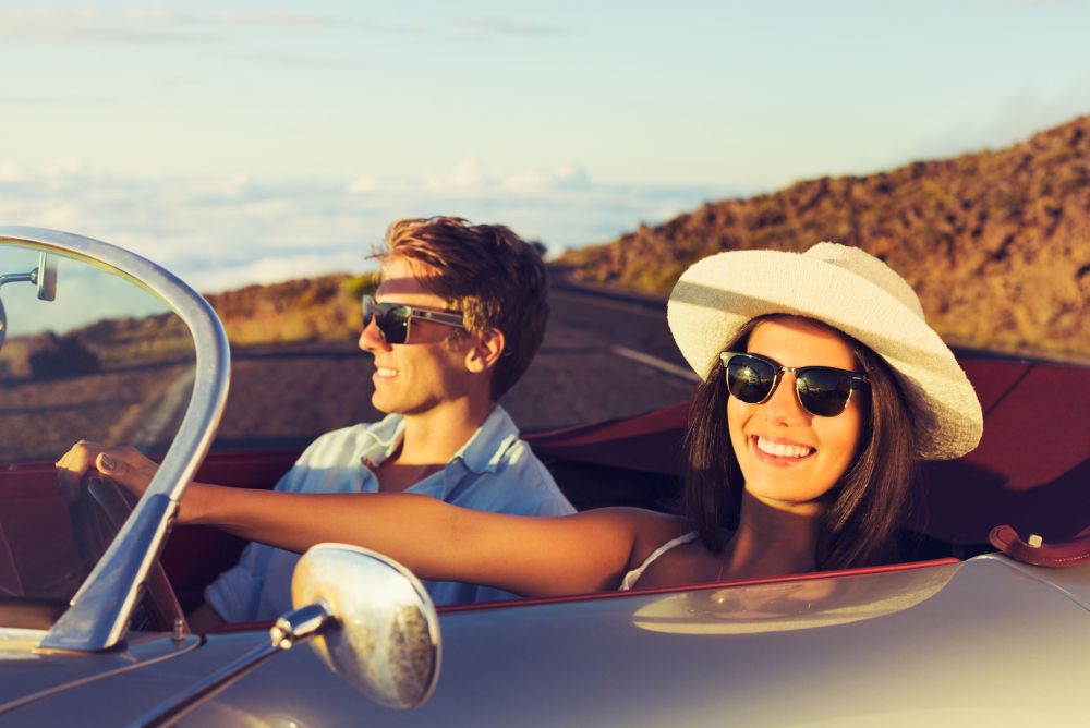 Young Couple in Classic Vintage Sports Car